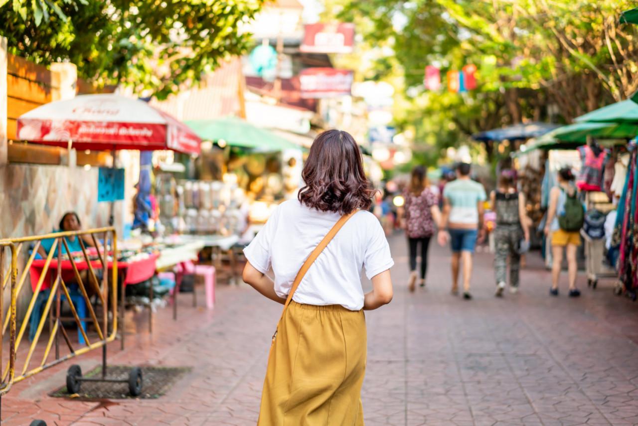 happy beautiful asian woman traveling khao sarn road thailand